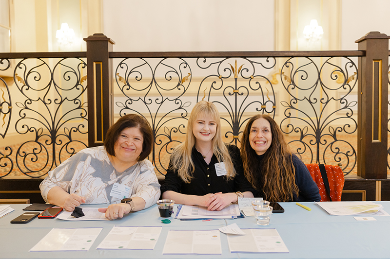 Image of NACE Chicago board members greeting people at check-in for an event